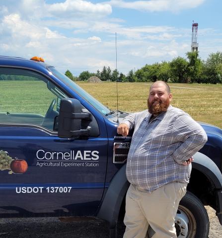 Phil standing next to Cornell AES Truck